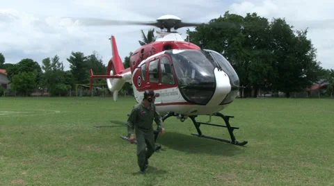 HELICOPTER GROUND STAFF PREPARE TAKE OFF Stock Footage 29150831