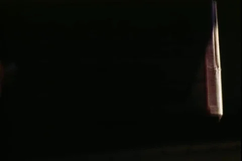 A helicopter gunner fires Machine Gun towards the ground from helicopter - 1972 Stock Footage 106060615