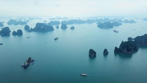 Helicopter Halong Bay sharp rocks blue seascape Cruise ships Landmark Vietnam Video stock 106985295