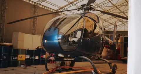 Helicopter in hangar, ready to take off Stock Footage 143500947