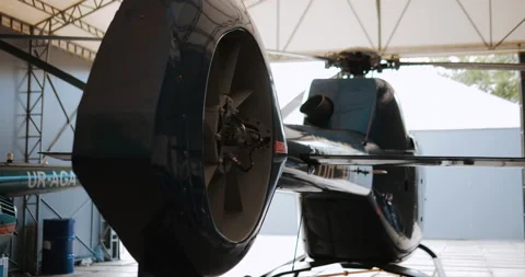 Helicopter in hangar, ready to take off Stock Footage 143501374