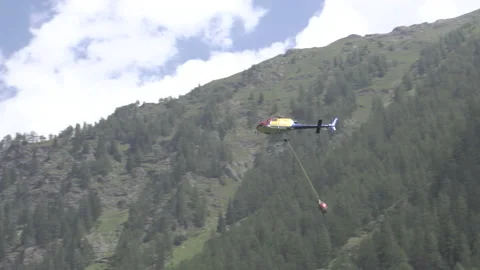 Helicopter with hanging Load in the Forest Video stock 136584074