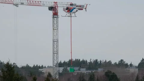 The helicopter hangs beacons on the high-voltage cable 스톡 동영상 153785000