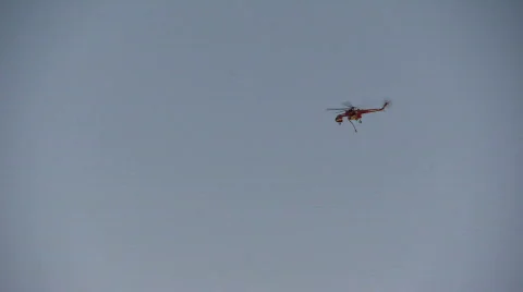 Helicopter heading to forest fire Stock Footage 877249