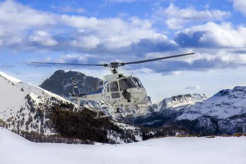 Helicopter in the high mountains Stock Photos