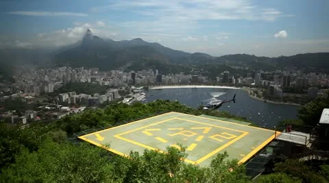 Helicopter hoovers over landing pad near Rio de Janeiro, Brazil Stock Footage 22234855