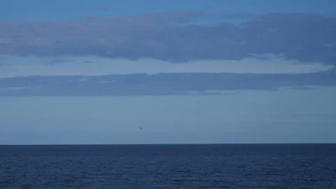 Helicopter hover over Blue sea in distance Pt1 of 2 Stock Footage 240926165
