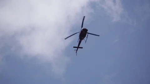 Helicopter hovering in the clouds over a natural disaster. Ellicott City, MD Video stock 70537799