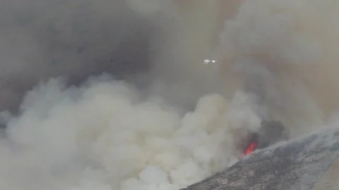 Helicopter Hovering Over Mountain Fire Stock Footage 115347552
