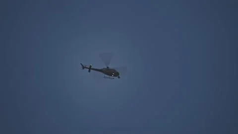 Helicopter Hovering Overhead at Night Stock Footage 132017601