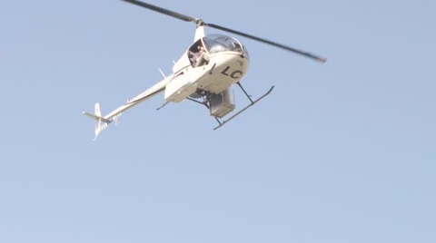 Helicopter hovering through the air Stock Footage 65885967