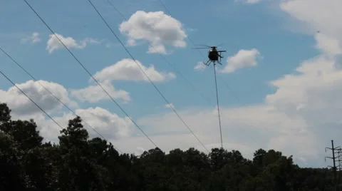 A helicopter hovers above the tree line Stock Footage 41455875