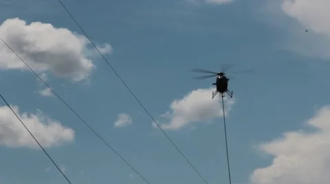 Helicopter hovers over power lines Stock Footage 41455871