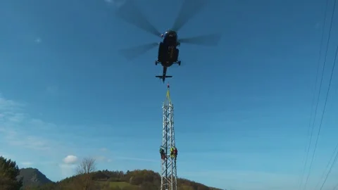 Helicopter Installing Electricity Pylon Stock Footage 341968056