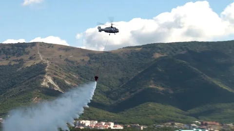 Helicopter Ka-32 demonstrates fire extinguishing over waters of Gelendzhik Bay. Stock Footage 125610234