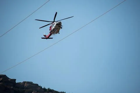 A helicopter from the LAFD performs a water drop and observation during a bru 写真素材