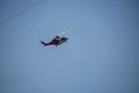 A helicopter from the LAFD performs a water drop and observation during a bru 写真素材