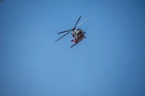 A helicopter from the LAFD performs a water drop and observation during a bru Stock Photos
