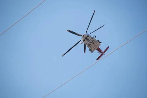 A helicopter from the LAFD performs a water drop and observation during a bru 写真素材