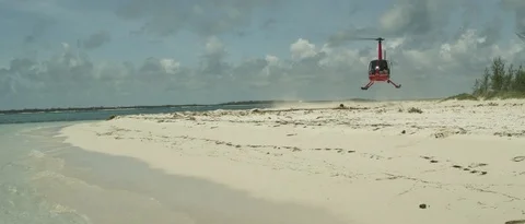 Helicopter Landing on a beach Stock Footage 73580806