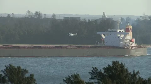 A helicopter landing on cargo ship Stock Footage 11524501
