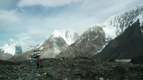 The Helicopter Landing In The Mountain Stock Footage 159655627