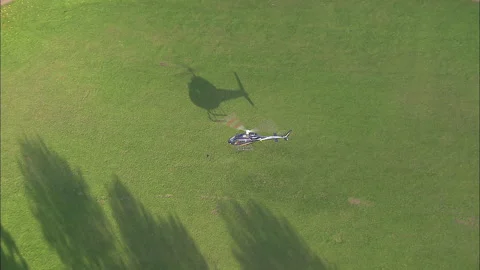 Helicopter landing in a park. Stock Footage 278041397