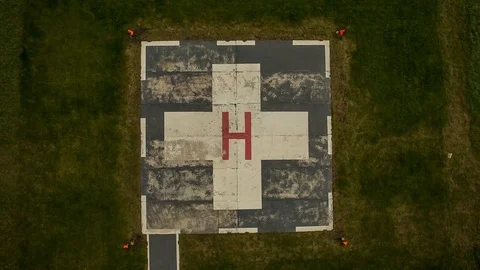 The helicopter landing vertically on the helipad. The camera looks down. 스톡 동영상 72690234