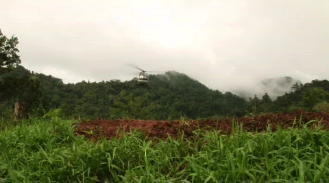 Helicopter lands in the jungle Stock Footage 520190