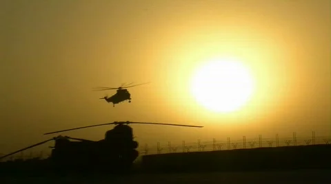 Helicopter Lands at Sunset (HD) m Stock Footage
