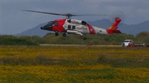 Helicopter liftoff to a hover Stock Footage 61894210