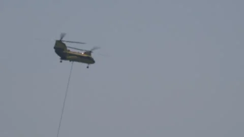 Helicopter with a Long Cable in the Air Vidéo 348156237