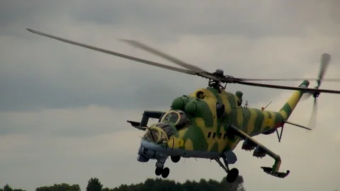 Helicopter Mi-35 (Hind) performs aerobatics with rotation around its axis. Stock Footage 123905348