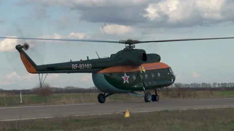 Helicopter Mi-8 (NATO: Hip)has landed and is moving along runway. Stock Footage 139761637