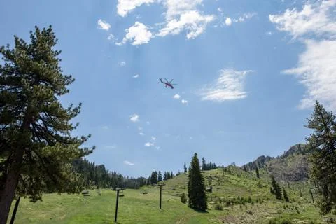 Helicopter in Mountains Stock Photos