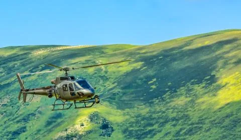 Helicopter in Mountains Stock Photos