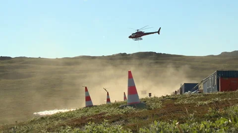 Helicopter with net leaving a mining site in Greenland Arctic Stock Footage 59736643