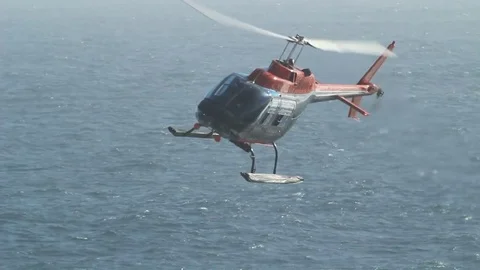 Helicopter over beach Видео 77052288