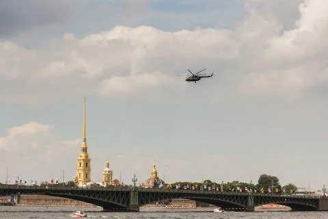Helicopter over the bridge. Stock Photos