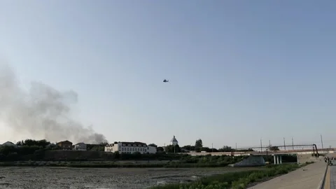 Helicopter over the city on the background of a fire Stock Footage 159960914