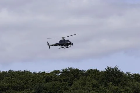 Helicopter over the forest Stock Photos
