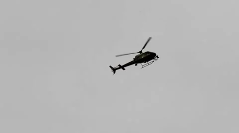 Helicopter in a pale sky flies right Stock Footage 49832941
