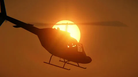 Helicopter passing through the sun Stock-Footage 38045746