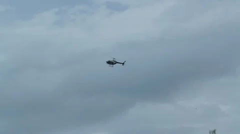 Helicopter on patrol and sharp left turn 1 Stock Footage 11699941