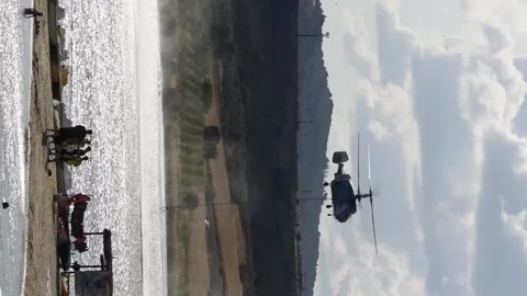 Helicopter performs water drop to combat forest fire in rural area Stock Footage 313017134
