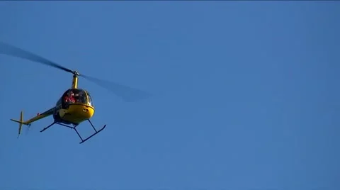 Helicopter for personal use flying on the sky Stock Footage