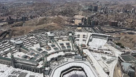 Helicopter perspective of the Holy Kaaba and massive architecture of the Grand Stock Footage 340195159