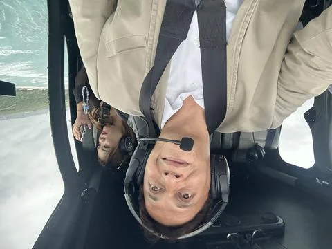 Helicopter pilot in action Stock Photos