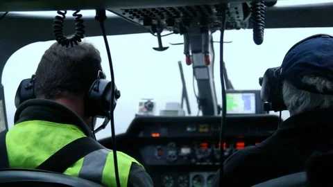 Helicopter pilot and copilot view from behind flying in cloud v2 Stock Footage 118266355