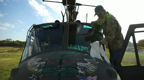Helicopter Pilot Cleaning Windshield Stock-Footage 12532528